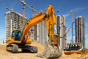 Garra levantando arena en una construcción